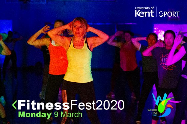 Five women all wearing fitness gear taking part in a fitness class with their arms up by their head.