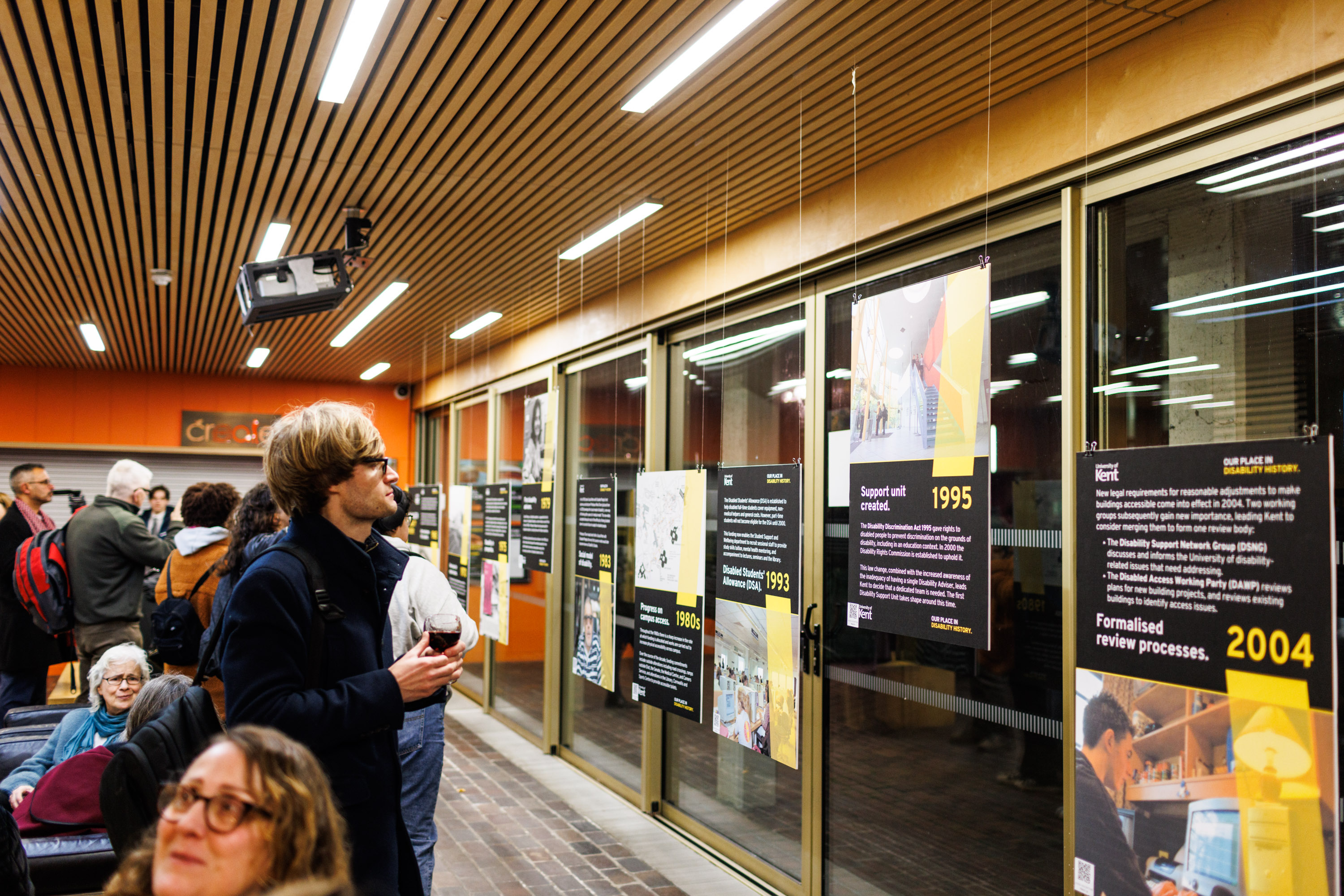 person looking at panels in a gallery